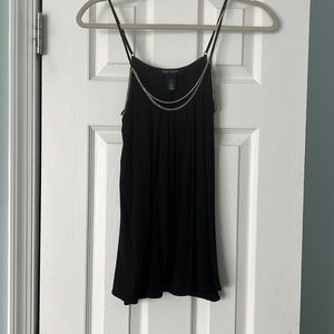 White House Black Market black XS flowing tank with silver chain embellishment.